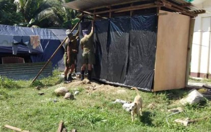 <p><strong>REBUILDING.</strong> Troops from the Armed Forces of the Philippines help rebuild tents in an evacuation site in Makilala, North Cotabato, on Monday (Nov. 11, 2019). Tents in the town's evacuation sites were heavily damaged by the strong winds, heavy rain, and hailstorm. <em>(Photo courtesy of Lt. Col. Ezra Balagtey)</em></p>