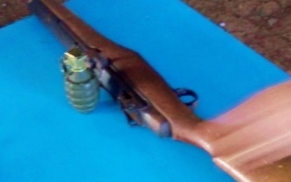 <p><strong>SURRENDER.</strong> The .30-caliber Garand rifle and hand grenade yielded by New People’s Army instructor Jimmy Aba Salune who surrendered to the military in Lebak, Sultan Kudarat on Monday (Nov. 11, 2019). Before his surrender, Salune was also the leader of Team Cherry Mobile of the New People’s Army West Daguma Front - Far South Mindanao regional command. <em>(Photo courtesy of 6IB)</em></p>