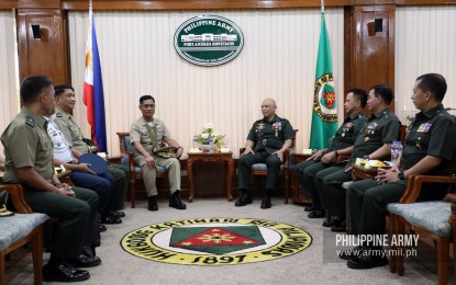 <p><strong>BRIEFING ON MODERNIZATION.</strong> Vice Admiral Gaudencio Collado (left), AFP vice chief of staff, shares a light moment with Army commander, Lt. Gen. Macairog Alberto (right), during his visit to the Army headquarters on Monday (Nov. 11, 2019). Alberto discussed with ranking military officials the Army's modernization achievements and endeavors in terms of its newly activated units, equipment, and facilities. <em>(Photo courtesy of Army Chief Public Affairs Office)</em></p>