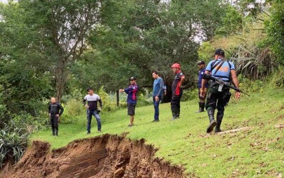 <p><strong>INSPECTION.</strong> Personnel from the Office of Civil Defense (OCD) and the local government of Tubungan, Iloilo conduct an ocular inspection at a landslide area on Saturday (Nov. 9, 2019). The OCD advised the public to be on alert, especially on landslide-prone areas identified by the latest report of the Department of Environment and Natural Resources-Mines and Geosciences Bureau. <em>(Photo courtesy of OCD 6)</em></p>