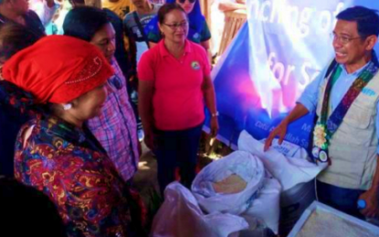 <p><strong>FORTIFIED RICE FOR SCHOOLS.</strong> World Food Program Cotabato head, Dr. Mischael Argonza leads the launching of a feeding program for school children in Datu Abdullah Sangki, Maguindanao along with BARMM education officials on Tuesday (Nov. 12, 2019). The fortified iron rice program for schools across the region aims to help improve school attendance and academic performance of the children. <em>(Photo courtesy of MBHTE-BARMM)</em></p>