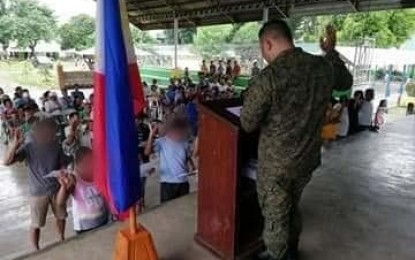 <p><strong>OATH OF ALLEGIANCE TO GOV’T.</strong> Former members of the New People's Army (NPA) and their supporters take an oath of allegiance to the government following their voluntary surrender in Barangay Antipolo, Bongabon, Nueva Ecija last Nov. 9, 2019. Maj. Gen. Lenard Agustin, commander of the Army's 7th Infantry Division (7ID), said that since the implementation of President Rodrigo Duterte’s Executive Order No. 70 instituting the whole-nation-approach in attaining peace, there has been an increasing number of communist rebels and supporters who have returned to the fold of law. <em>(File photo courtesy of the Army's 7th Infantry Division)</em></p>
