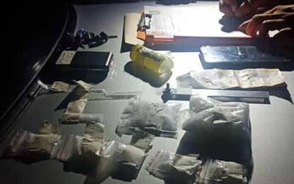 <p><strong>SEIZED</strong>. Anti-illegal drug operatives seize some PHP1 million worth of suspected shabu during a buy-bust Tuesday night (Nov. 12, 2019) in Dumaguete City. The suspect, Regi Calugcugan, is a probationer who is tagged by authorities as a "high-value target" at the provincial level. <em>(Photo by Juancho Gallarde)</em></p>