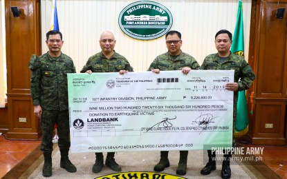 <p><strong>FUNDING TEMPORARY SHELTERS.</strong> Army chief, Lt. Gen. Macairog Alberto (2nd from left) turns over the ceremonial check worth PHP9,226,000 to 10th Infantry Division commander, Maj. Gen. Jose Faustino Jr. (2nd from right) and Disaster Response Task Force head, Brig. Gen. Rodolfo Lavadia Jr. (right) in Fort Bonifacio on Thursday (Nov. 14, 2019). The funds came from the portion of the November meal allowance donated by all Army troops which will be used to purchase land where temporary shelters for earthquake victims in Mindanao will be built. <em>(Photo courtesy of Army Chief Public Affairs Office)</em></p>