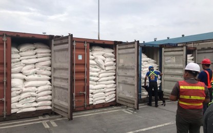 <p><strong>SMUGGLED SUGAR.</strong> Customs officials inspect PHP4.4 million worth of smuggled sugar at the Port of Manila on Wednesday (Nov. 13, 2019). The shipments were declared to contain steel coils but an examination conducted on the containers showed that they contained Korach conditioned refined sugar. <em>(Photo courtesy of BOC)</em></p>