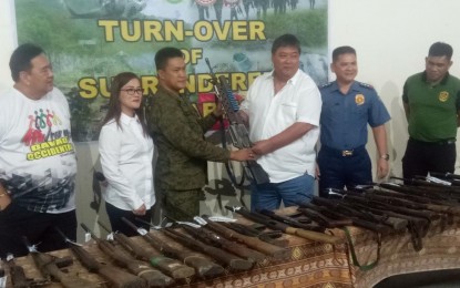 <p><strong>TURN OVER OF FIREARMS.</strong> Lt. Col. Ronaldo Valdez, commander of the Army's 73rd Infantry Battalion based in the Davao Occidental town of Malita, leads the turnover of high-power firearms surrendered by former New People's Army rebels on Tuesday (Nov. 12). Governor Claude Bautista has offered PHP2 million for every top NPA leader who surrenders to the provincial government. <em>(PNA photo by Eldie Aguirre)</em></p>