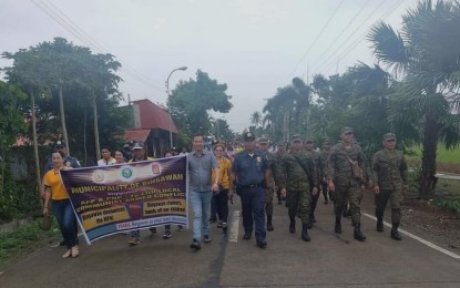 <p><strong>WALK FOR PEACE.</strong> Government officials, security forces, and the local populace in Bingawan town, Iloilo hold a Walk for Peace on Thursday (Nov. 14, 2019). The activity shows their unity in ending insurgency and the town has formed its Municipal Task Force in Ending Local Communist Armed Conflict and subsequently declared the Communist Party of the Philippines-New People's Army as unwelcome. <em>(Photo courtesy of Philippine Army 61st IB)</em></p>