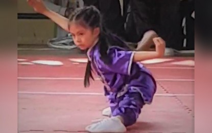<p><strong>LIKE FATHER LIKE DAUGHTER</strong>. Jherisse Athena O. Calica performs during the Benjamin Magalong Baguio Olympics wushu tournament at the SPED gymnasium here Sunday (Nov. 10, 2019). The seven-year-old daughter of 2001 Southeast Asian Games gold medalist Jerome Calica won gold medal in the tournament. (<em>Photo courtesy of Jearome Calica)</em></p>
