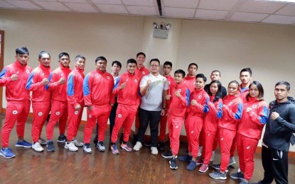 <p><strong>KICKBOXING TEAM</strong>. The first Philippine Kickboxing Team that will see action in the Southeast Asian Games this December pose with Samahang Kickboxing ng Pilipinas leaders. Three of the members of the national team are Team Lakay members including former world wushu sanda champion Jean Claude Saclag (left). Also in the photo is Gina Inion (3rd from right). <em>(Photo courtesy of SKBP)</em></p>