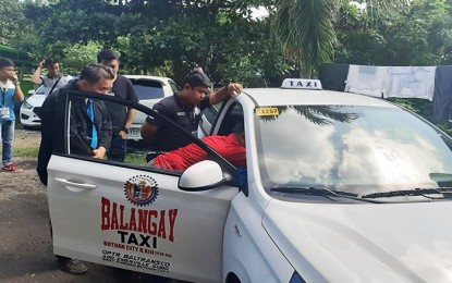 <p><strong>NEW TAXIS.</strong> Personnel from the Land Transportation Franchising and Regulatory Board in Caraga Region inspects the 13 new taxis which will start to serve the commuters of Butuan City and the rest of the region on Saturday, November 16.<em> (Photo courtesy of LTFRB-13 Facebook Page)</em></p>