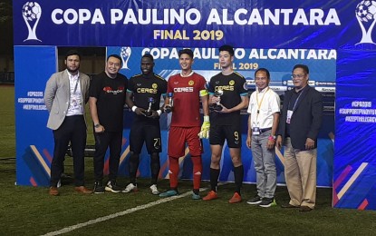 <p><strong>AWARDEES.</strong> (Third from left) Robert Mendy, Roland Muller, and Tadashi Odawara receive their individual awards during the Copa Paulino Alcantara Cup held at the Biñan Football Stadium in Laguna. Ceres Negros claimed the Copa Paulino Alcantara title after beating Kaya Iloilo, 2-1, completing a domestic double and ending its domestic season undefeated.<em> (PNA photo by Ivan Saldajeno)</em></p>