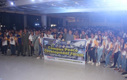 <p><strong>ANTI-NPA FORUM</strong>. Officials and students pose for a photo opportunity after the Campus Peace Development Forum at the Leyte Normal University Gymnasium on Saturday (Nov. 16, 2019), organized by the Philippine Air Force. The activity seeks to shield students from the recruitment of the New People’s Army. <em>(Photo courtesy of the Philippine Air Force)</em></p>