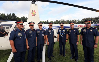 <p><strong>NEW EQUIPMENT.</strong> PNP officer-in-charge, Lt. Gen. Archie Gamboa (3rd from right) poses with other ranking police officials during the blessing and turnover of newly-acquired equipment in Camp Crame on Monday (Nov. 18, 2019). The acquisition of new equipment is aimed at boosting the PNP's operational capability and visibility.<em> (PNA photo by Joey Razon)</em></p>