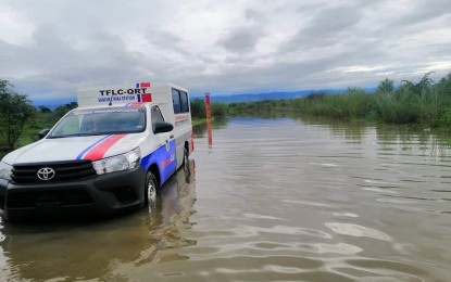 <p><strong>CAGAYAN FLOOD</strong>. Task Force Lingkod Cagayan personnel monitor the flood at Tawi bridge in Peñablanca, Cagayan on Tuesday (Nov. 19, 2019). At least 1,497 families or 5,487 people evacuated in 11 towns of Cagayan province on Monday night as Typhoon "Ramon" hit the northern Philippines. <em>(Photo courtesy of Task Force Lingkod Cagayan)</em></p>
