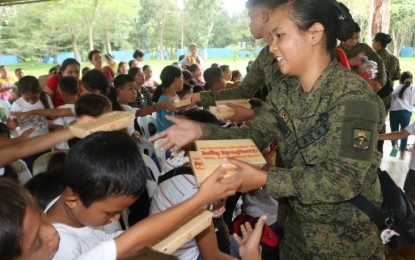 <p><strong>'LAKBAY BATA'</strong>. About 300 children and their parents belonging to the least-privileged families from the outskirt sitios of Barangays Anitapan, Golden Valley, Cabuyoan, Cadunan and Libudon, all of Mabini town in Compostela Valley Province benefit from the 'Lakbay Bata 2019' in Tagum City, Davao del Norte on Friday (Nov. 22, 2019). The program is an initiative of the Army's 71st Infantry Battalion in cooperation with various government agencies and local government units. (Photo courtesy of 71IB)</p>
