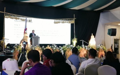 <p><strong>RICE CONFERENCE</strong>. Department of Agriculture Assistant Secretary for Operations, Dr. Andrew Villacorta, delivers the keynote address of Secretary William Dar during the opening of the National Rice Industry Stakeholders Conference in Iloilo City on Monday (Nov. 25, 2019). The conference hopes to come up with initiatives that would further improve and protect the industry. <em>(PNA photo by Perla G. Lena)</em></p>