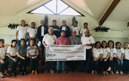 <p><strong>TURN OVER</strong>. The Bishop Carlito Cenzon Foundation turned over a check amounting to about P1.4 million to the Baguio-Benguet Diocese led by Bishop Victor Bendico (3rd from left holding check) with father Ronald Ablasa Jr. parish priest of the Christ the King Quasi Parish Church in Loo, Buguias, Benguet (2nd from left). The church is the beneficiary of the foundation organized Bishop's Cup, a golf tournament last Nov. 8. <em>(Photo from the FB page of Victorino Agcaoili)</em></p>