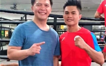 <p><strong>CONFIDENT</strong>. Team Lakay founder and former South East Asian Games wushu sanda gold winner Mark Sangiao (left) is confident that the kickboxing team of which three of his wards are part of will win gold medals in the biennial meet next month. Here, Sangiao is with Muay Thai waikru and paksa representative Jearome Calica, his teammate in the 2011 PH wushu team who also won a gold in his weight category, 52 kilogram.<em> (Photo from the FB of Mark Sangiao)</em></p>