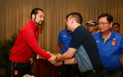 <p><strong>APOLOGY.</strong> The Philippine Southeast Asian Games Organization Committee chair Alan Peter Cayetano shakes hands Myanmar coach Velizar Popov (left) as he expressed apology for the inconveniences encountered by the football teams on Sunday (Nov. 26, 2019). The House Speaker promised that the Philippine hosting will be great and meaningful for everyone. <em>(SEA Games photo)</em></p>