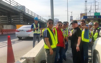 <p><strong>EASING SLEX TRAFFIC</strong>. SMC president and chief operating officer Ramon S. Ang inspects work on the Skyway Extension project at the Alabang viaduct. The company is set to reopen the third lane of the at-grade Skyway--which it closed for construction in late September--as well as the new two-lane ramp on December 1. With this, northbound vehicles will have five lanes coming from the Alabang viaduct, compared to just three lanes, prior to construction. <em>(Photo courtesy of SMC)</em></p>