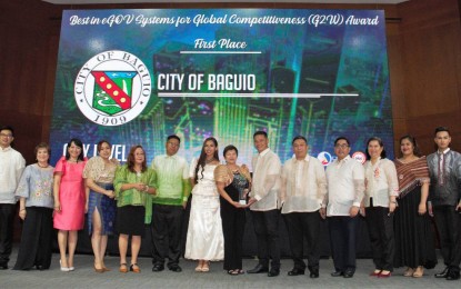 <p><strong>DIGITAL GOVERNANCE AWARDS '19.</strong> Representatives of Baguio City are awarded first place in the city level of the "Best in eGOV Business Empowerment" category during the Digital Governance Awards (DGA) 2019 at the Philippine International Convention Center on Nov. 26, 2019. The highest-scoring local government units in the six categories of the event were given all-expenses-paid trip to Huawei's headquarters in China for an international learning program on digital governance.<em> (Photo courtesy of DICT Communications Officer Danica Navarro)</em></p>