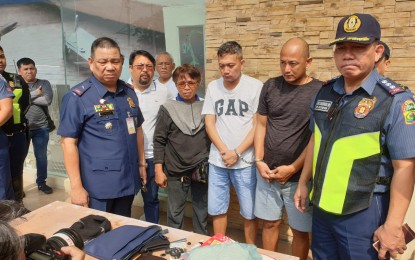 <p><strong>DRUG COURIERS.</strong> Police officers present to the media two suspects who were arrested in a follow-up operation in Las Piñas City on Wednesday (Nov. 27, 2019). Joel and Merwin Bustamante, alleged couriers of Chinese drug suspect Liu Chao who was earlier arrested in Makati City, yielded PHP115.6 million worth of shabu during the operation. <em>(Photo courtesy of Southern Police District)</em></p>