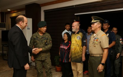 <p><strong>SAFE AND SOUND. </strong>Military officials and US Ambassador Daniel Pruce (left) welcome Allan and Wilma Hyrons at the Villamor Airbase in Pasay City on Monday (Nov. 25, 2019). The couple were rescued by government troops in Sulu from their Abu Sayyaf captors. <em>(Photo courtesy of PAF Public Affairs Office)</em></p>