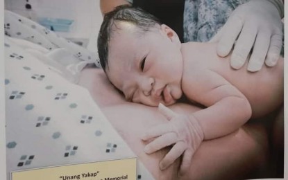 <p><strong>CHILD HEALTH.</strong> A photo of a mother and her newborn child getting their first skin-to-skin contact is displayed at the Department of Health 6 (Western Visayas) exhibit for National Children’s Month at SM City, Iloilo on Tuesday (Nov. 27, 2019). Dr. Renilyn Reyes, family health and nutrition cluster head of DOH-6, said the health department stresses the importance of newborn screening and the provision of human milk to infants. <em>(PNA photo by Gail Momblan)</em></p>