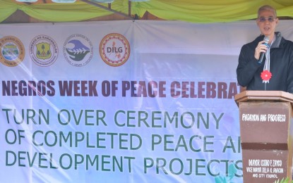 <p><strong>PEACE AND DEV’T PROJECTS.</strong> Negros Occidental Governor Eugenio Jose Lacson delivers a message during Tuesday's (Nov. 26, 2019) turnover of completed projects to the Kapatiran para sa Progresong Panlipunan, Inc. (Kapatiran), which is finalizing a closure peace agreement with the Philippine government. The group received PHP25.181 million worth of infrastructure projects from the Negros Occidental provincial government. <em>(Photo courtesy of Richard Malihan/PIO Negros Occidental)</em></p>