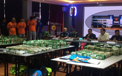 <p><strong>BIG CATCH.</strong> Ranking officials of agencies leading the anti-illegal drugs campaign present PHP2.6 billion worth of shabu and three suspects, including a Chinese national, at the PNP Crime Laboratory in Camp Crame on Thursday (Nov. 28, 2019). The PNP considers the drug haul is so far the biggest volume of illegal drugs confiscated by authorities this year. <em>(PNA photo by Lloyd Caliwan)</em></p>