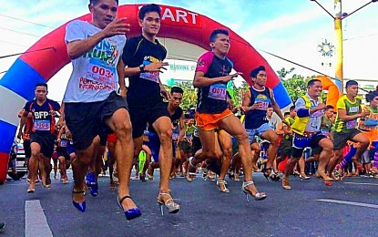 <p><strong>'TOUR DE TAKONG'.</strong> Men from all walks of life run while wearing stilettos (high heel shoes) during the 'Tour de Takong' in Marikina City on Saturday (Nov. 30, 2019). The event, which is part of the city's annual Shoe Festival, aims to promote women empowerment. <em>(Photo courtesy of Marikina City PIO)</em></p>