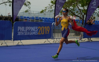 <p><strong>DUATHLETE GOLD MEDALIST.</strong> Filipina duathlete Monica Torres delivers an early gold medal for the Philippines on the second day of the 30th Southeast Asian Games at the Subic Bay Boardwalk, Subic Bay Freeport on Monday (Dec. 2, 2019). Torres dominated the women's finals, registering 2 hours, 8 minutes and 44 seconds to win in the 10-kilometer run, 40-kilometer bike, and 5-kilometer run. <em>(Photo by Austine Morfe)</em></p>