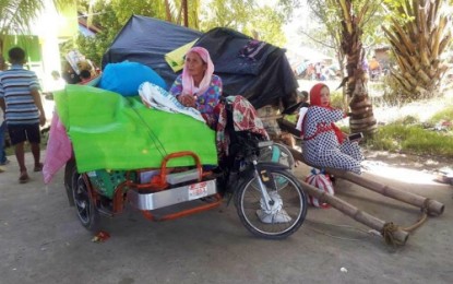 <p><strong>LONGING FOR HOME.</strong> A Muslim mother and her pregnant daughter wait for the go-signal from the military and town officials of Shariff Aguak, Maguindanao for them to return home soon in their community on Monday (Dec. 2, 2019). Almost 2,000 families from at least six villages in Shariff Aguak were displaced by the ongoing military operations in the area that started on Nov. 24, 2019. <em>(Photo courtesy of Shariff Aguak MIO)</em></p>