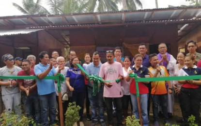 <p><strong>TEMPORARY SHELTERS.</strong> Officials in North Cotabato lead the ribbon cutting during the turnover ceremony of the initial five temporary transitional shelters in Barangay Magbok, Tulunan, North Cotabato on Monday (Dec. 2, 2019). Vice-Governor Emmylou Taliño-Mendoza has asked future donors to the earthquake-stricken areas to donate materials for the temporary transitional shelters instead of giving cash assistance to the municipality. <em>(PNA photo by Che Palicte)</em></p>