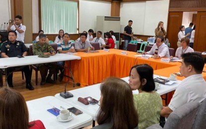 <p><strong>PRE-DISASTER RISK ASSESSMENT</strong>. The Pampanga Provincial Disaster Risk Reduction and Management Council headed by Governor Dennis Pineda (middle in white long polo shirt) conducts pre-disaster risk assessment for the possible onslaught of Typhoon “Tisoy” on Monday (Dec. 2, 2019). The governor instructs each member of the council to be on full alert’ for the potential risk that Tisoy might bring, especially to the upland and coastal areas of Pampanga. <em>(Photo from the Pampanga provincial government)</em></p>