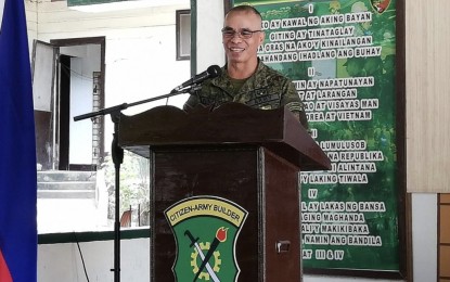<p><strong>ROTC CADETS AS FUTURE LEADERS.</strong> 7th Regional Community Defense Group commander, Colonel Ricky Bunayog speaks before Army Reservists and Basic Citizens Military Training cadets during his assumption of office on Oct. 26, 2019, at the 53rd Engineer Brigade Multi-Purpose Hall. Bunayog, a 2017 Metrobank Foundation Outstanding Filipino awardee, said that a stronger mandatory Reserve Officer Training Corps (ROTC) program will produce dynamic leaders for the future Philippine society.<em> (PNA photo by John Rey Saavedra)</em></p>