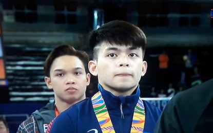 <p><strong>SECOND GOLD</strong>. Carlos Edriel Yulo (center) wins his second gold medal in artistic gymnastics at the Rizal Memorial Coliseum on Tuesday (Dec. 3, 2019). He snatched his first gold in individual all-around event last Sunday. <em>(Screengrab) </em></p>
