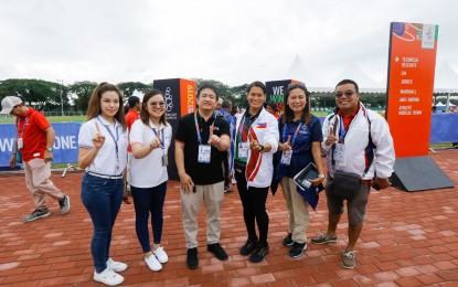 <p><strong>SUPPORTING THE ATHLETES.</strong> Renowned Filipino athlete Elma Muros (3rd from right) visits Clark Parade Grounds in Pampanga on Thursday (Dec. 5, 2019) to lend support to Filipino athletes competing in the archery and rugby sevens events in the Southeast Asian (SEA) Games 2019. Joining her during the visit are CDC - Communications Manager Noel Tulabut (third from left) and archery venue manager Myriam Punsalan (second from right). <em>(Photo by Clark Development Corporation-Communications Division)</em></p>