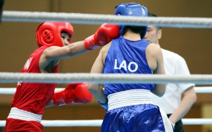 <p><strong>PINAY POWER.</strong> Filipina boxer Aira Villegas (left) connects a solid right to the head of Vilay Vongphachan of Laos in the women’s 44-kg. category of the 30th Southeast Asian Games boxing competition at the Philippine International Convention Center on Wednesday (Dec. 4, 2019). Villegas whipped Vongphachan, 5-0, to advance to the semifinals. <em>(PNA photo by Jess M. Escaros Jr.)</em></p>