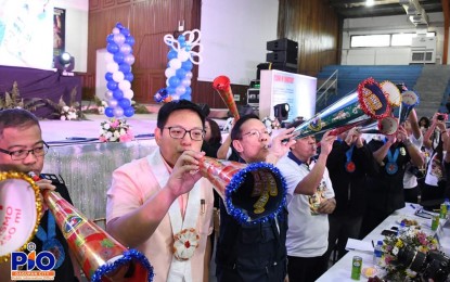 <p><strong>SAFE NOISEMAKERS.</strong> Department of Health Secretary Francisco Duque III (3rd from left), Dagupan City Mayor Marc Brian Lim (2nd from left), and other officials blow a "torotot" during the launching of 2019 Iwas Paputok drive at Dagupan City on Thursday (Dec.5, 2019). Duque urged anew the public to use alternative noisemakers during the New Year's Eve revelry to prevent injuries. <em>(Photo courtesy of Dagupan Public Information Office)</em></p>