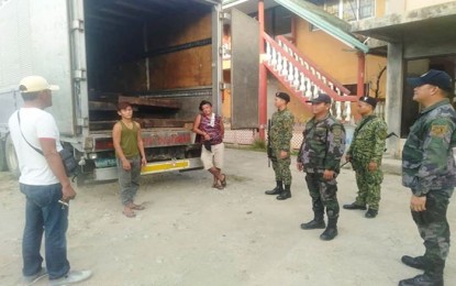 <p><strong>INTERCEPTED LUMBER.</strong> Joint elements of the Department of Environment and Natural Resources in Surigao del Norte and the Philippine National Police (PNP) intercept a 10-wheeler truck loaded with 3,697 board feet of sawn Magkuno tree in Barangay Lipata, Surigao City on Sunday (Dec 8, 2019). The contraband has an estimated value of PHP732,424. <em>(Photo courtesy of PENRO Surigao del Norte)</em></p>