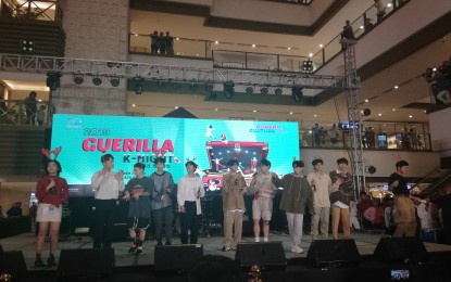 <p><strong>GUERILLA K-NIGHT.</strong> The group Any Name's Okay, We Are the Night, SB19, and Kremesoda sing "All I Want for Christmas is You" during the Guerilla K-Night at the Shangri-La Plaza in Mandaluyong City on Dec. 7, 2019. Since last year, the Korean Cultural Center (KCC) in the Philippines has been staging a "Guerilla K-Night" during the Christmas season, as part of Korean and Filipino cultural celebrations. <em> (PNA photo by Cristina Arayata)</em></p>