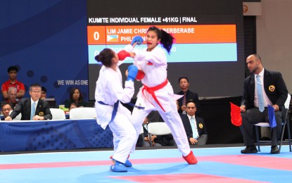 <p><strong>FATHER'S BET</strong>.  Jamie Christine Lim (right) connects as she defeated Indonesian Ceyco Zefanya in the women's 61-kg kumite individul event to clinch the gold medal in the 30th Southeast Asian Games karatedo competitions at the World Trade Center in Pasay City on Monday (Dec. 9, 2019).  Jaime is the daughter of former basketball star Samboy Lim.  <strong><em>(PNA photo by Jess M. Escaros Jr.)</em></strong></p>