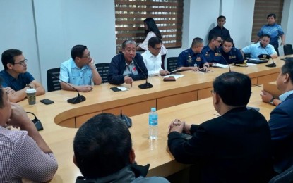 <p><strong>NO 'DOUBLE-BERTHING' IN PASIG RIVER.</strong> Government officials led by the Department of Transportation (DOTr) Secretary Arthur Tugade (3rd from upper left) discuss the cleanup of Pasig River at the Manila City Hall on Tuesday (Dec. 10, 2019). In a memorandum circular, the Philippine Coast Guard (PCG) prohibited the double-berthing of barges along Pasig River as part of the government's efforts to clean up the river and promote ferry service as a viable mode of public transportation. <em>(Photo courtesy of PCG)</em></p>