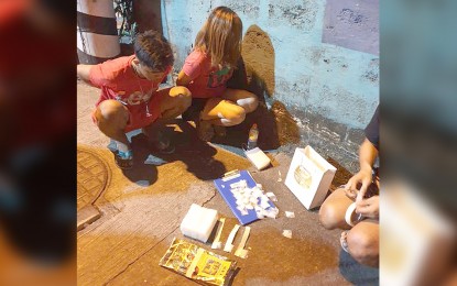 <p><strong>MARIKINA DRUG BUST.</strong> Suspects Christian Lucero and Jomalyn Poblete yield PHP7.4 million worth of shabu in a buy-bust operation in Marikina City on Monday (Dec. 9, 2019). The contraband is believed to be part of the PHP2.5 billion worth of shabu seized from a Chinese national in a separate operation in Makati City last November 29. <em>(Photo courtesy of NCRPO)</em></p>