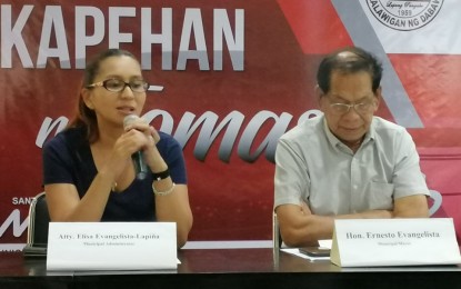 <p><strong>PEACE PROTOCOL.</strong> Lawyer Elisa Lapiña, municipal administrator of Santo Tomas in Davao del Norte, explains the town's "peace protocol" during a press conference on Monday (December 9, 2019). Beside her is her father, Mayor Ernesto Evangelista. <em>(PNA photo by Che Palicte)</em></p>