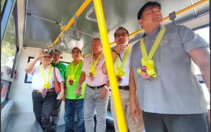 <p><strong>MODERN PUJS.</strong> Cagayan de Oro City Mayor Oscar Moreno (center), and Land Transportation Franchising Regulatory Board (LTFRB) Region 10 director Amenodin Guro, join other officials inside the newly-arrived 'modern jeepney' on its maiden run on Tuesday. The unit is a fully air-conditioned Hino brand unit with Wi-Fi and Card swiping machine, an additional eight passengers can stand in the aisle if seating capacity is already full. <em>(PNA photo by Ercel Maandig)</em></p>