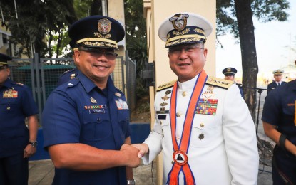 <p><strong>PROMOTED.</strong> Philippine Coast Guard Commandant Admiral Joel Garcia (right) was welcomed with arrival honors by Coast Guard officials and personnel at the PCG national headquarters in Manila on Wednesday (Dec. 11, 2019). President Rodrigo Duterte approved the promotion of Garcia from Vice Admiral to Admiral effective Dec. 9, 2019. <em>(Photo courtesy of PCG PIO)</em></p>