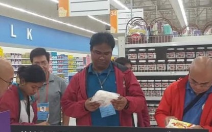 <p><strong>INSPECTION.</strong> A team of the Provincial African swine fever (ASF) Task Force checks the processed foods being sold in a local supermarket as part of the enforcement of 'The ASF Prevention Ordinance of Negros Occidental' on Monday (Dec. 9, 2019). Some 43 establishments have been ordered to pull out from their shelves all pork products which originated from Luzon and identified ASF-affected countries.<br /><em>(Photo courtesy of Provincial ASF Task Force-Negros Occidental)</em></p>