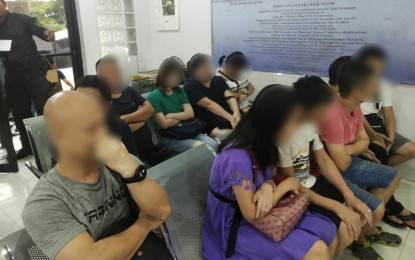 <p><strong>NABBED.</strong> Immigration officials take into custody 11 Chinese nationals at the BI detention facility in Camp Bagong Diwa, Taguig City on Wednesday (Dec. 11, 2019). The Chinese nationals were caught working without the required visa and failed to present their passports or any other immigration documents. <em>(Photo courtesy of BI)</em></p>